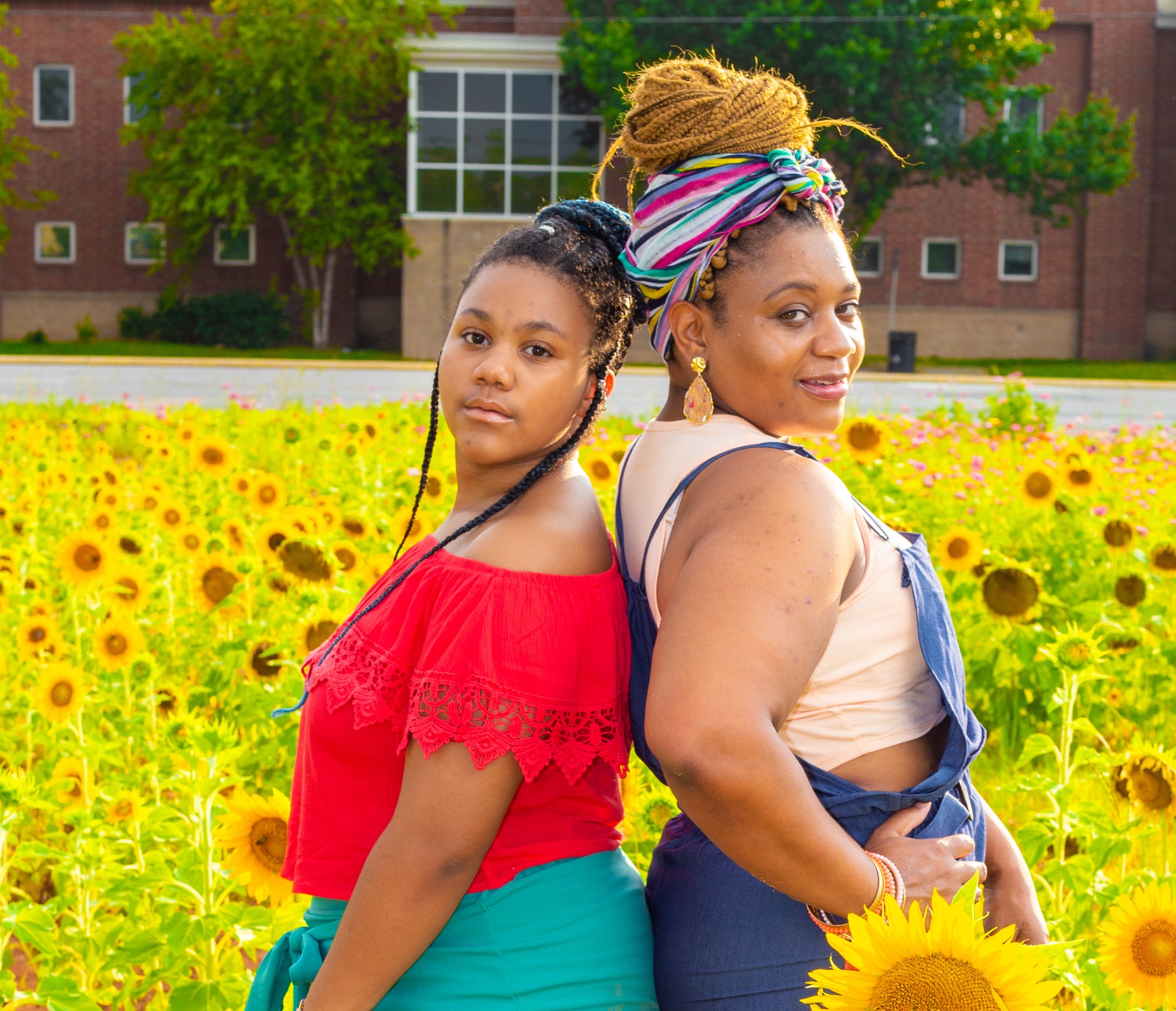 Kayla Mallet and her daughter, Rissy in a field of sunflowers